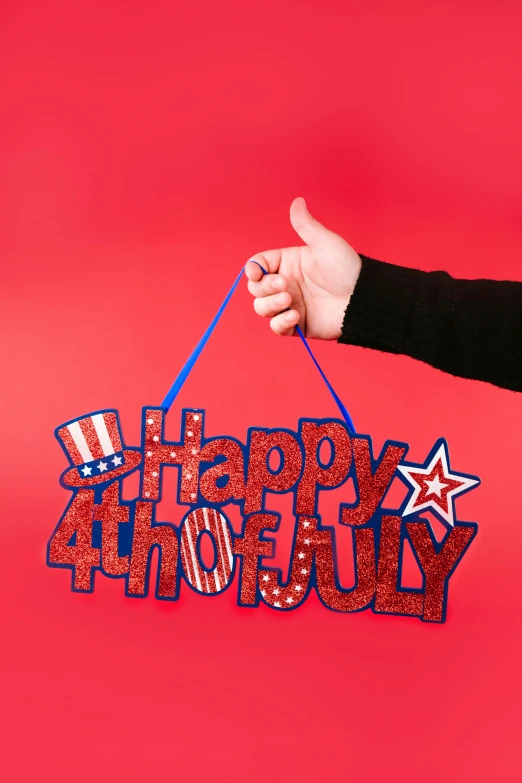 a person holding a sign that says happy 4th of july, by Julia Pishtar, official product photo, foam, alternate angle, 4l