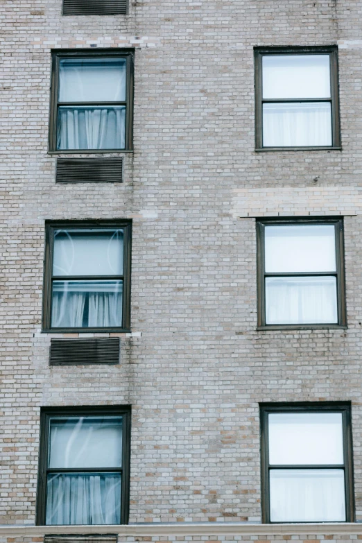 a fire hydrant in front of a brick building, inspired by Louis Stettner, unsplash, modernism, house windows, ignant, hotel room, panels