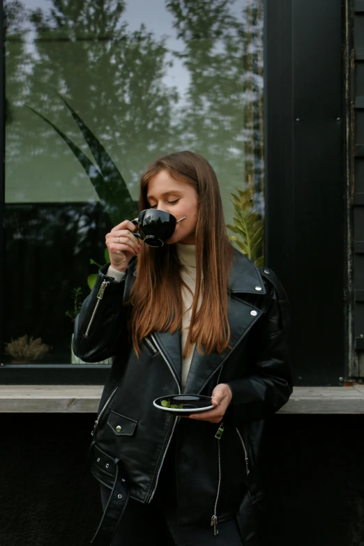 a woman taking a picture of herself with a camera, pexels contest winner, happening, woman drinking coffee, black leather jacket, portrait sophie mudd, profile image