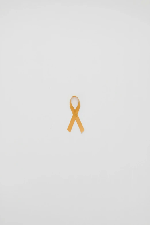 an orange ribbon on a white background, by Attila Meszlenyi, conceptual art, remembrance, yellow, tumours, gemma chen