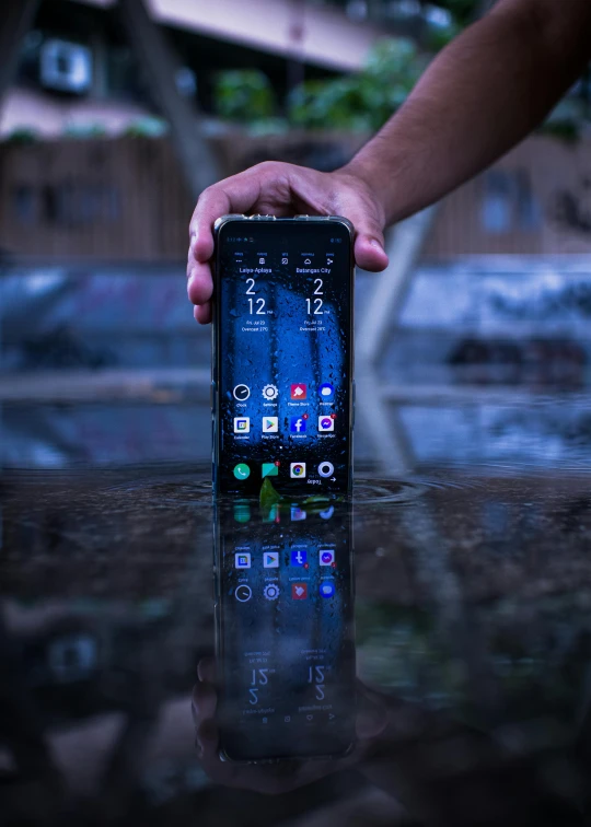 a close up of a person holding a cell phone, a hologram, by Android Jones, unsplash, standing in a lake, ((monolith)), promo image, ready to model