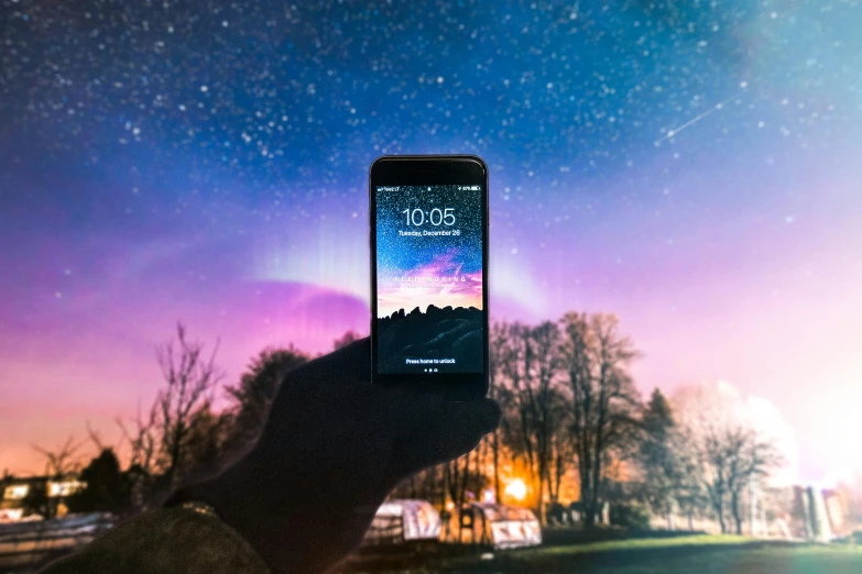 a person taking a picture of the night sky, by Julia Pishtar, pexels contest winner, realism, a painting of an iphone, gradient mixed with nebula sky, picture through the screen, space ship in the distance