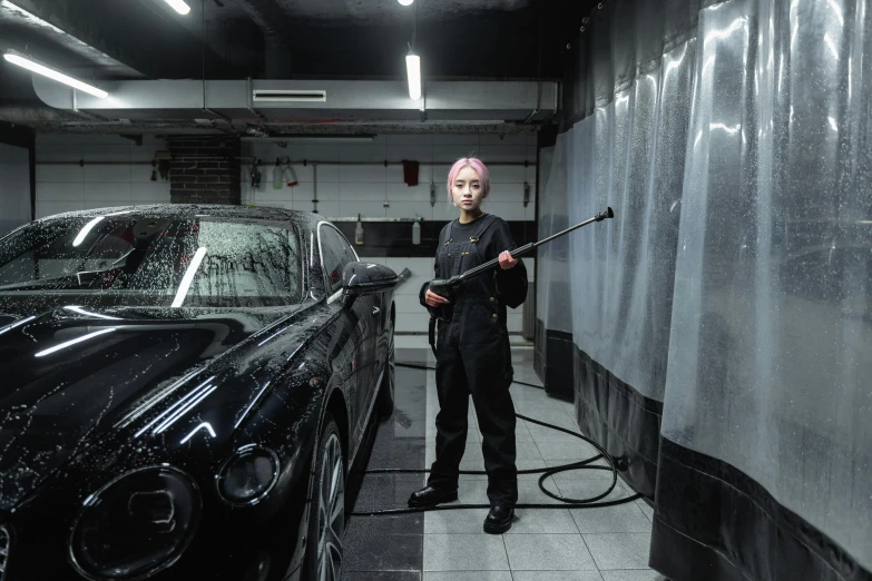 a man washing a black car in a garage, a portrait, by An Gyeon, pexels contest winner, hyperrealism, female cyberpunk, jossi of blackpink, a person standing in front of a, cinematic outfit photo