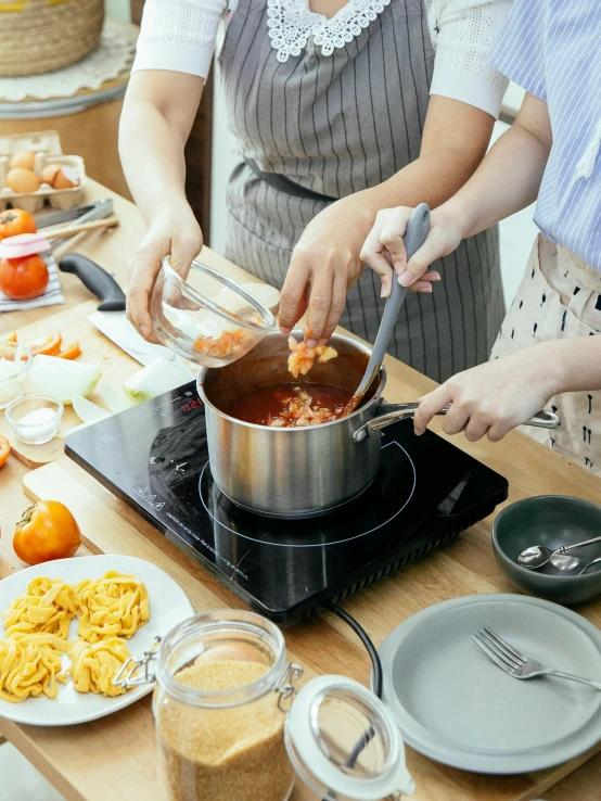 a group of people preparing food in a kitchen, inside a glass jar, fan favorite, product introduction photo, thumbnail