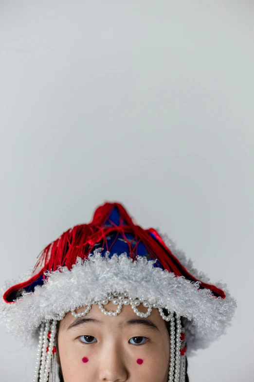 a little girl wearing a red, white and blue hat, an album cover, inspired by Frans Hals, reddit, close - up studio photo, christmas, high resolution photo, chile