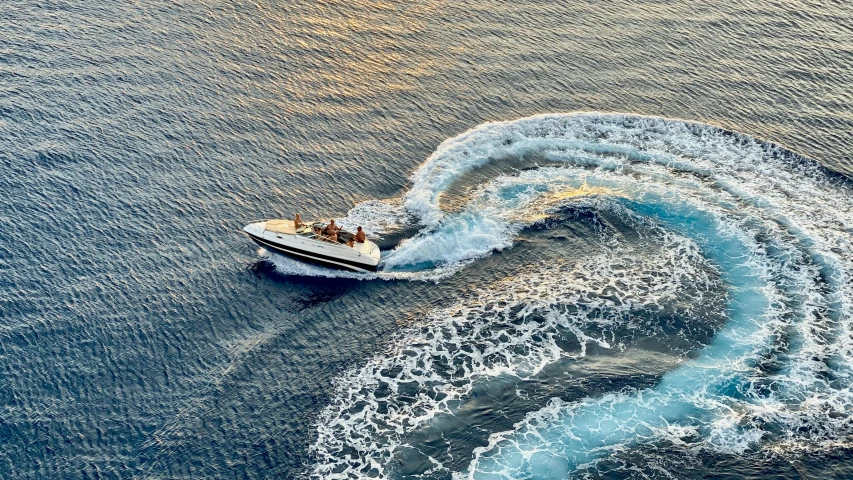 a small boat in the middle of a body of water, a digital rendering, pexels contest winner, water jets, on a yacht at sea, mastercraft, hard morning light