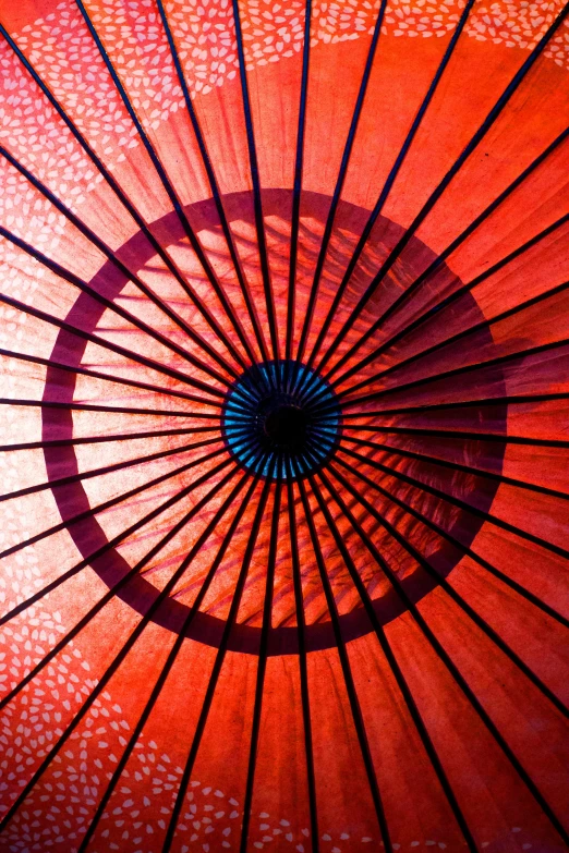 a close up view of a red umbrella, inspired by Shibata Zeshin, flickr, centered radial design, inner glow, orange, concert