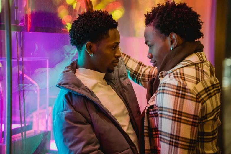 a couple of people standing next to each other, trending on pexels, visual art, 2 1 savage, neon lit, two men hugging, [ theatrical ]