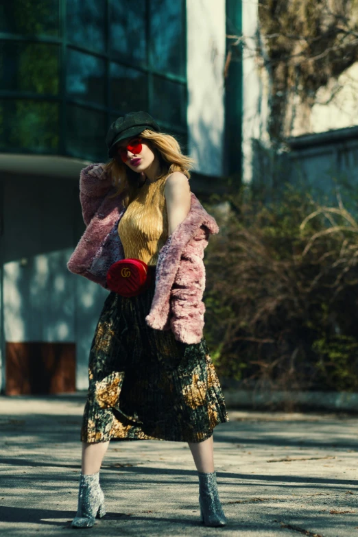 a woman that is standing in the street, a picture, inspired by Elsa Bleda, trending on pexels, renaissance, gucci clothes, synthetic fur, woman with rose tinted glasses, advertising photo