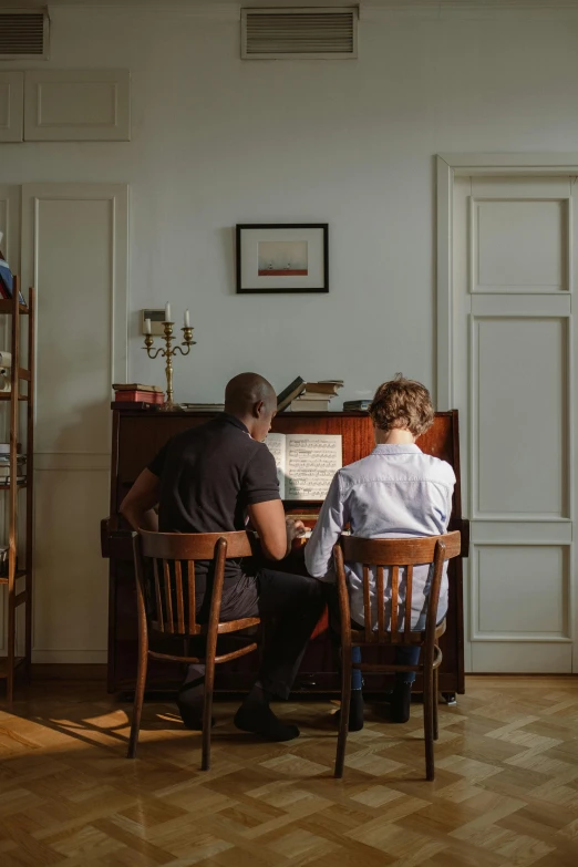 a couple of people that are sitting at a piano, hammershøi, best practice, man sitting facing away, home