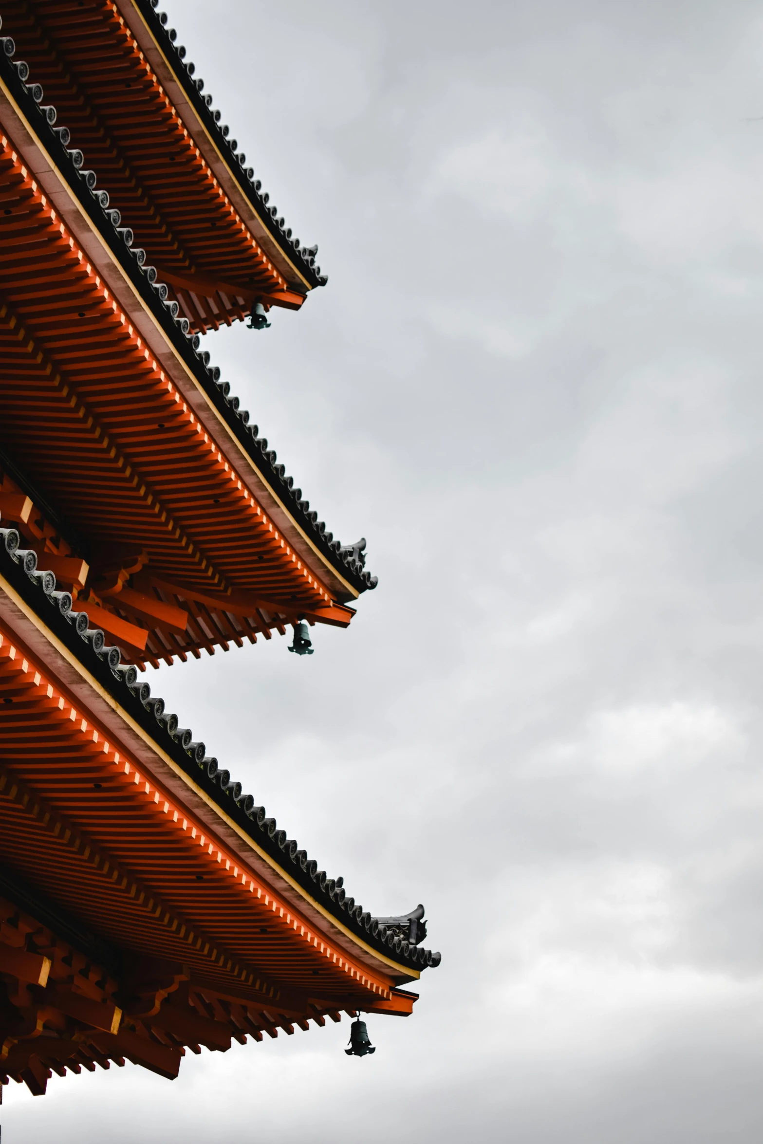 a tall building with a clock on top of it, inspired by Itō Jakuchū, trending on unsplash, orange roof, detail structure, overcast, the imperial palace