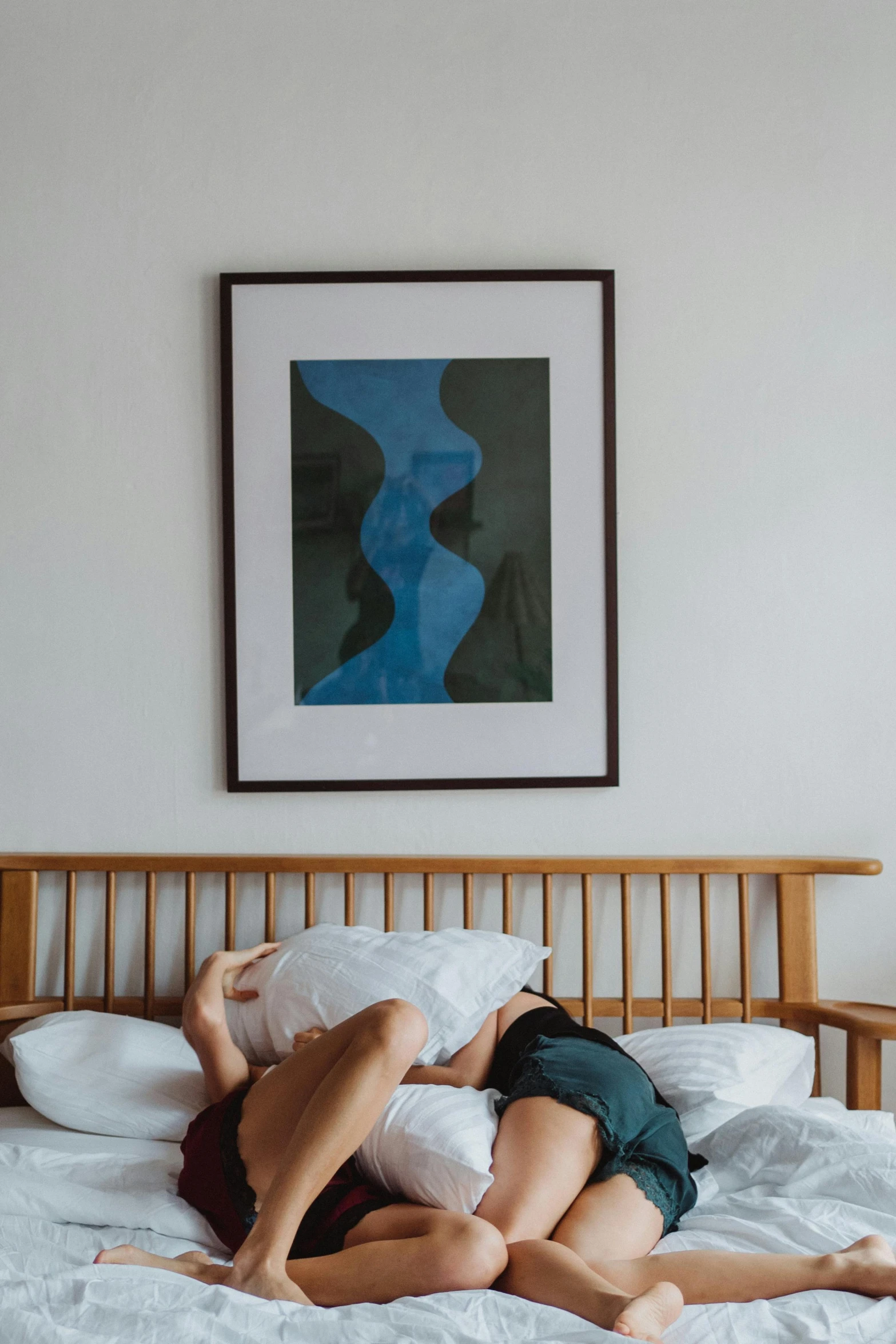 a couple of people laying on top of a bed, poster art, pexels contest winner, visual art, tightly framed, blue print, standing in corner of room, photo of a man