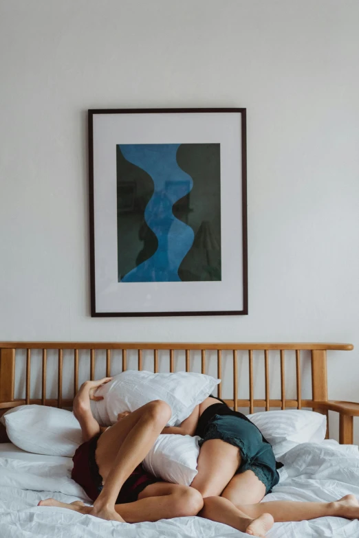 a couple of people laying on top of a bed, poster art, pexels contest winner, visual art, tightly framed, blue print, standing in corner of room, photo of a man