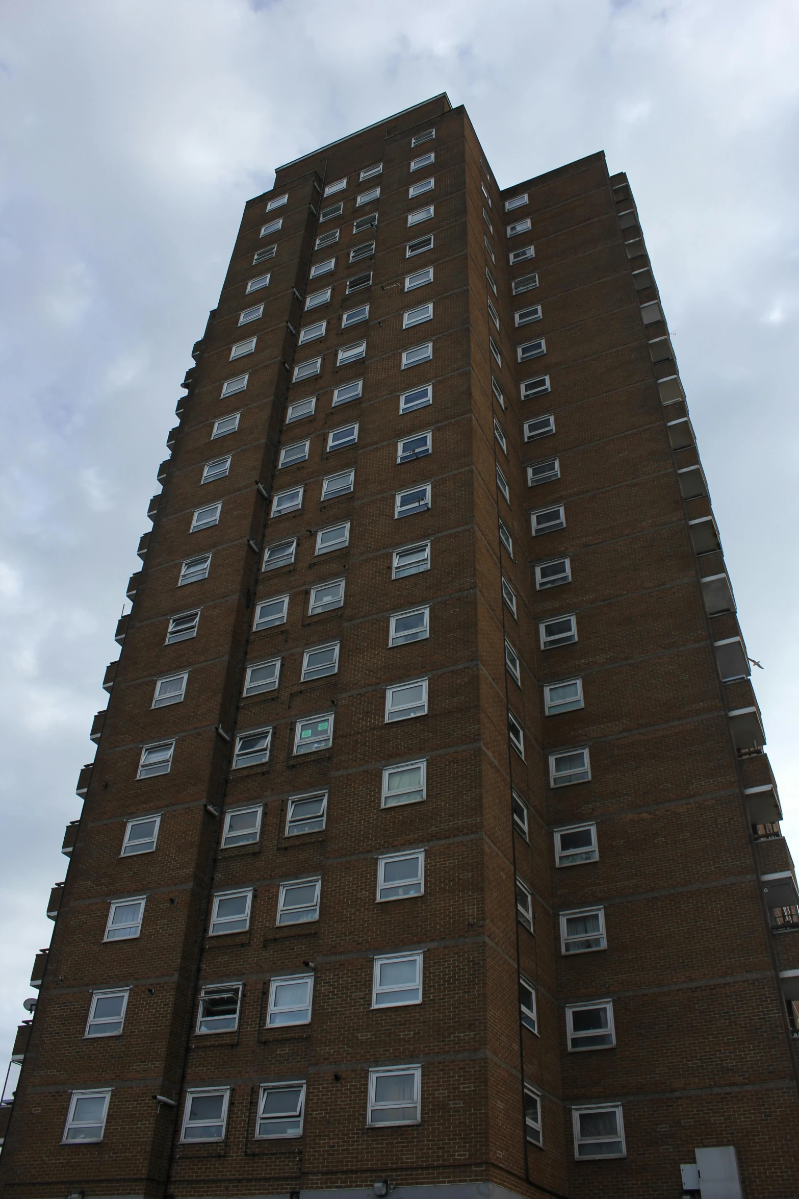 a tall brick building with lots of windows, inspired by Sir Jacob Epstein, very very clean, elstree, buildings