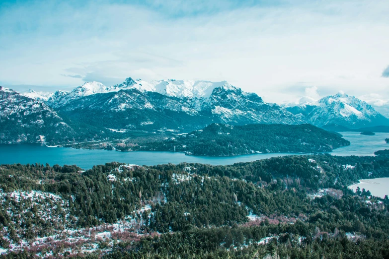 a view of a lake and mountains from the top of a mountain, by Sebastian Spreng, pexels contest winner, art nouveau, whistler, winter setting, thumbnail, conde nast traveler photo