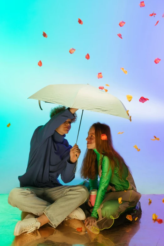 a man and a woman sitting under an umbrella, an album cover, unsplash, conceptual art, leaves in the air, fluorescent, ( ( theatrical ) ), color photograph
