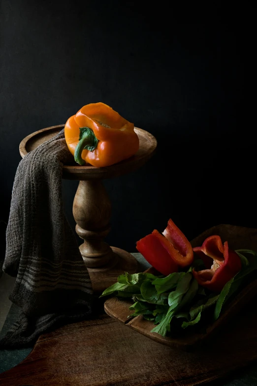 a bowl of peppers sitting on top of a wooden table, a still life, inspired by Adriaen van Ostade, unsplash contest winner, dark grey backdrop studio, on a pedestal, basil, looking towards camera
