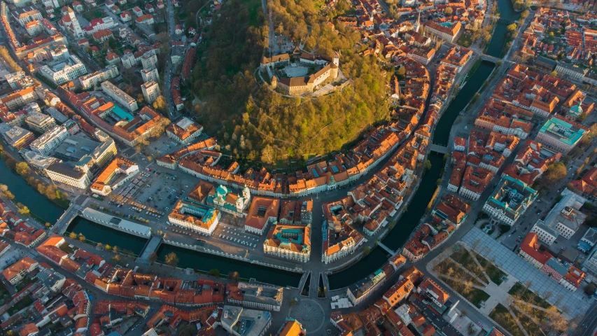 an aerial view of a city with a river running through it, by Sebastian Spreng, pexels contest winner, renaissance, slovenian, square, good light, extreme panoramic