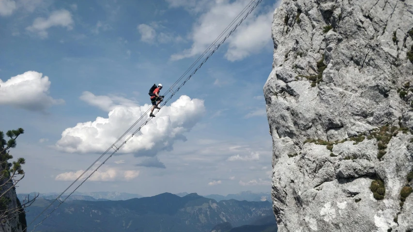 a man flying through the air while riding a zipline, by Erwin Bowien, pexels contest winner, rock climbers climbing a rock, avatar image