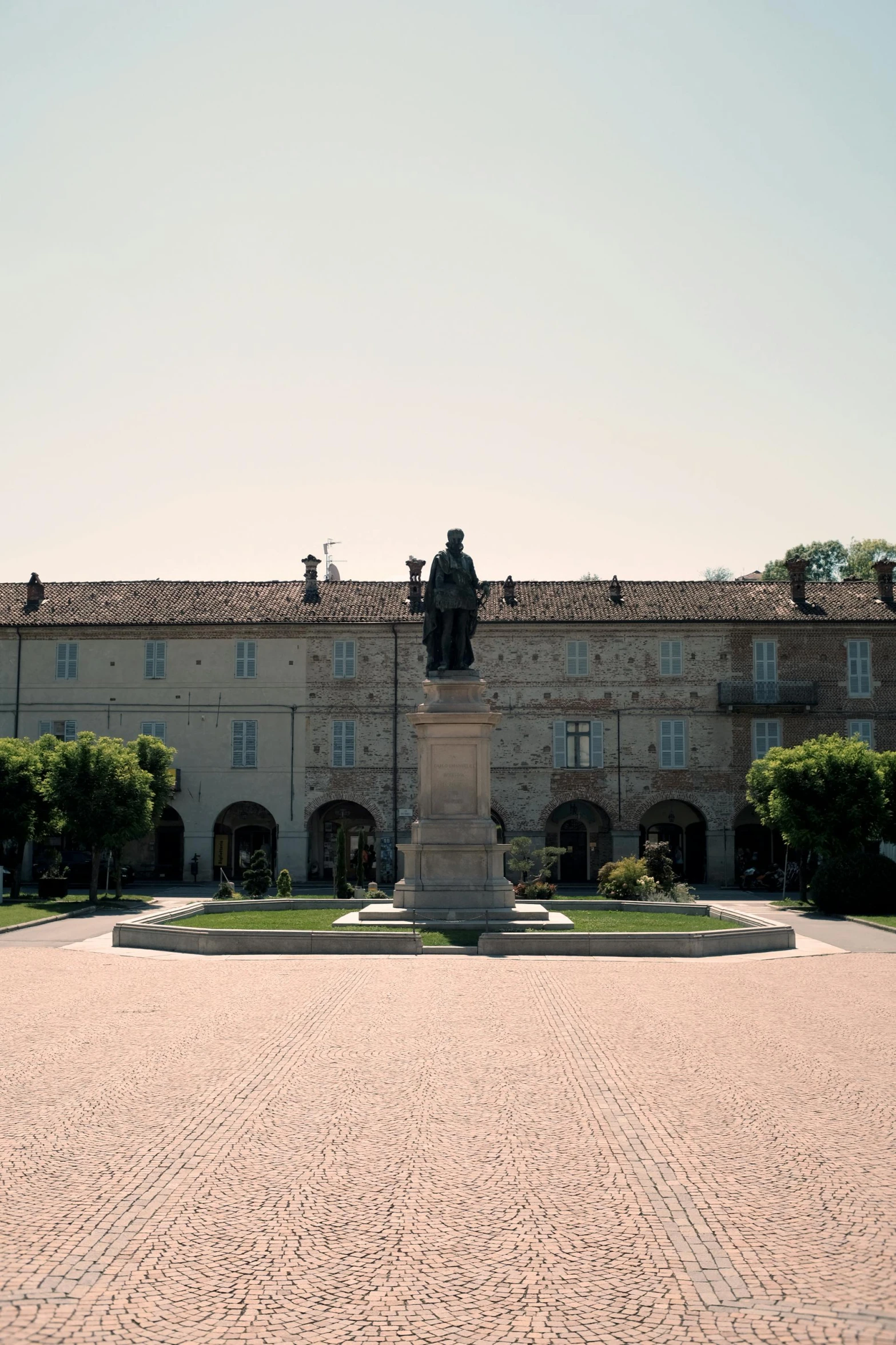 a large building with a fountain in front of it, a statue, inspired by Giovanni Battista Innocenzo Colombo, village square, ( ( theatrical ) ), multiple stories, grand library