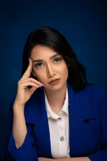 a woman sitting at a table talking on a cell phone, an album cover, by irakli nadar, trending on pexels, wearing blue jacket, elegant confident pose, beautiful iranian woman, professional headshot