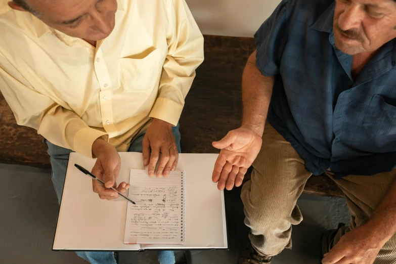 a couple of men sitting on top of a couch, pexels contest winner, renaissance, writing on a clipboard, local conspirologist, older male, detailed screenshot