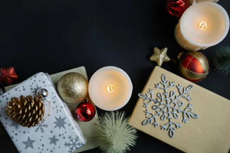 a group of christmas presents sitting on top of a table, holding a candle, flatlay, background image, ornaments