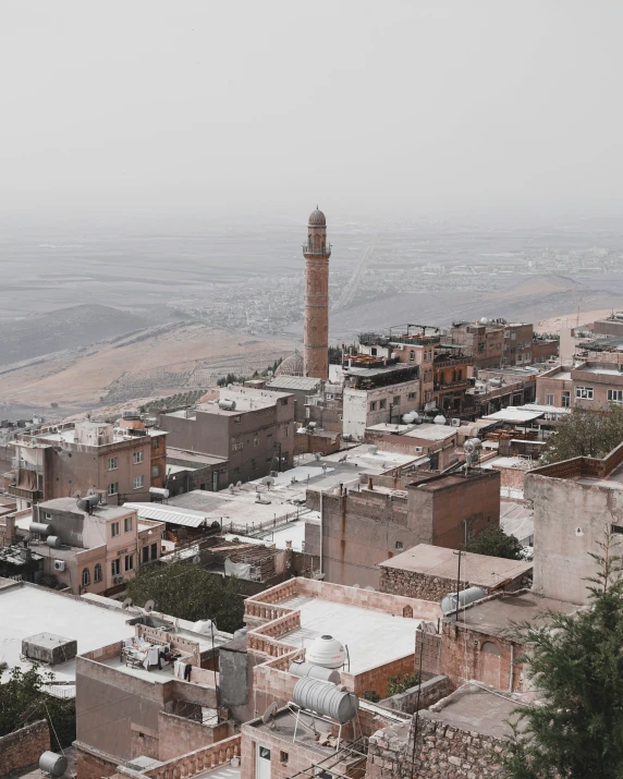 a view of a city from the top of a hill, pexels contest winner, les nabis, mardin old town castle, grey, trending on vsco, thick dust and red tones