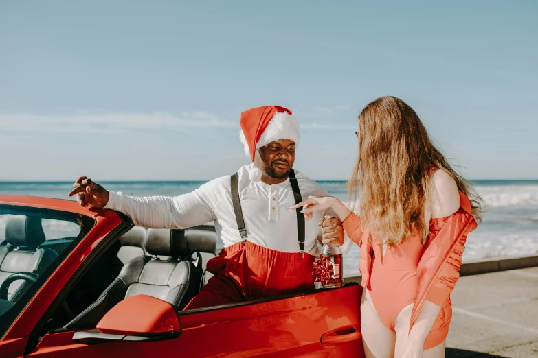 a man standing next to a woman in a red car, pexels contest winner, sitting on santa, is wearing a swimsuit, virgil abloh, rex orange county