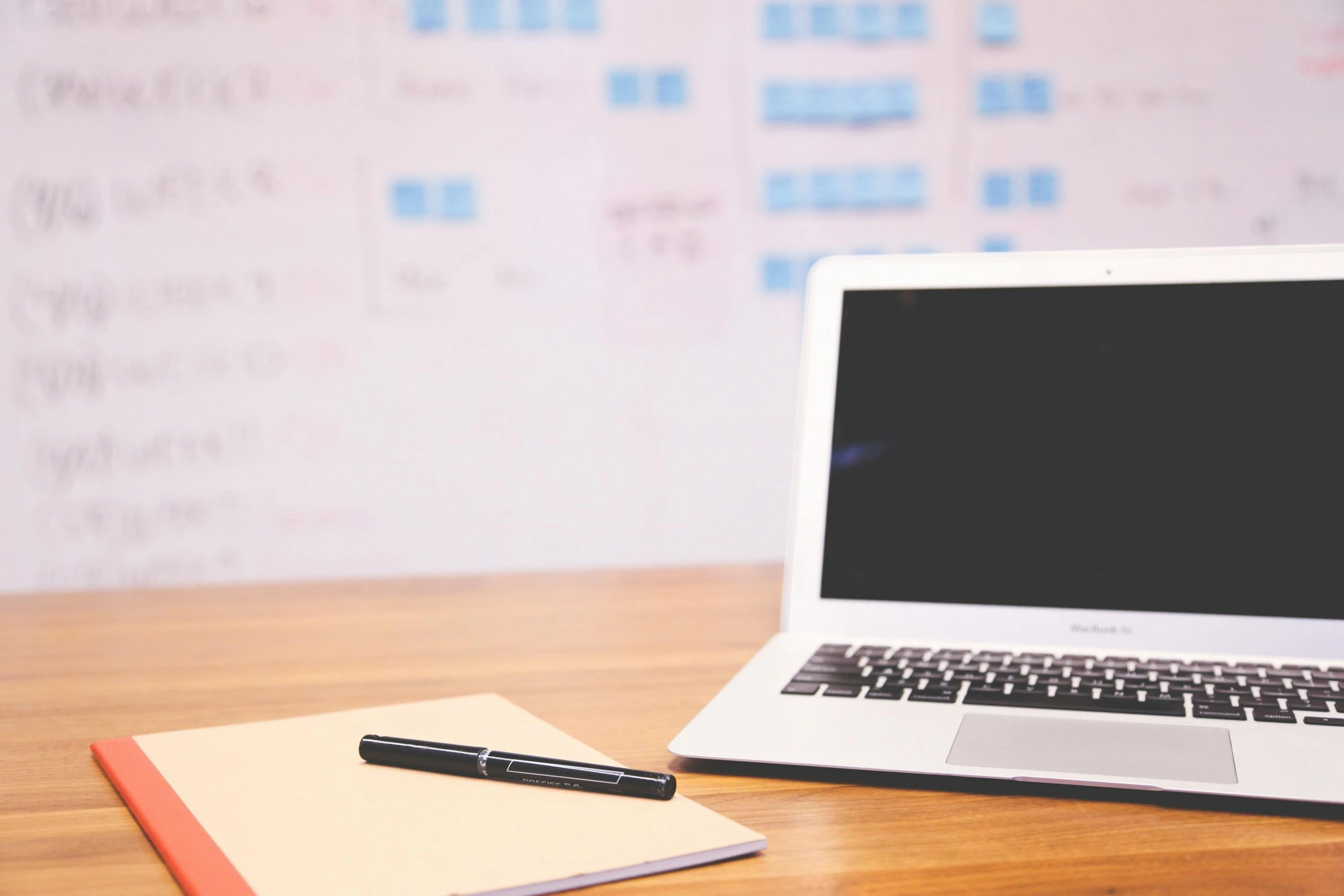 a laptop computer sitting on top of a wooden desk, by Daniel Lieske, trending on unsplash, whiteboards, background image, with notes, website banner