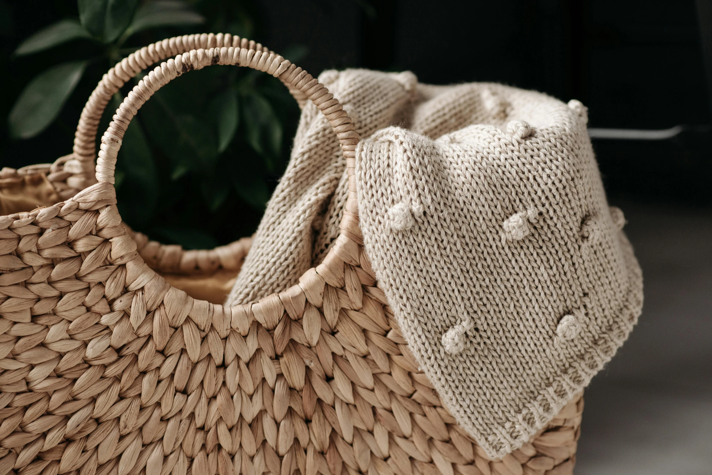 a straw bag sitting on top of a table, inspired by Károly Patkó, pexels contest winner, puffballs, lying in bed!!!! blanket, close-up product photo, thumbnail