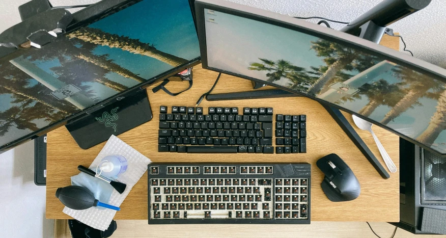 a desktop computer sitting on top of a wooden desk, mechanical keyboard, multiple wide angles, satisfying cable management, ergodox