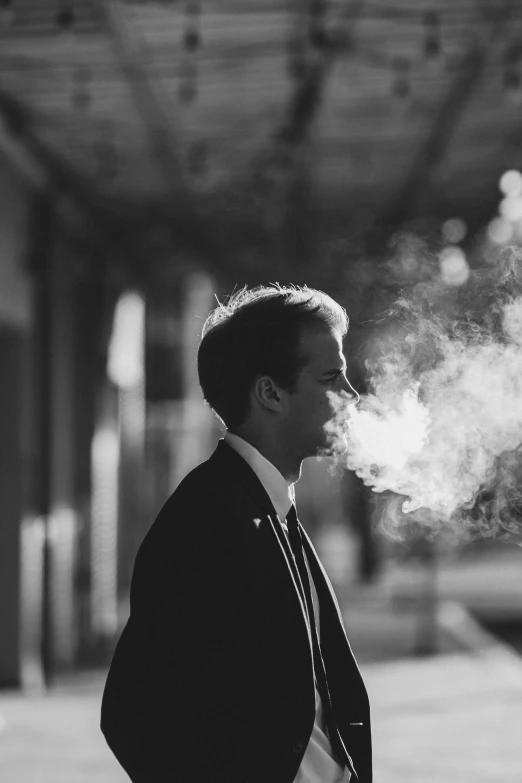 a man in a suit smoking a cigarette, a black and white photo, unsplash contest winner, aestheticism, high definition cgsociety, ✨🕌🌙, brandon woelfel, early morning mood