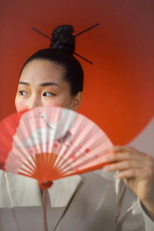 a woman holding a red fan in front of her face, inspired by Fan Qi, looking away from camera, sake, teamlab, ethnicity : japanese