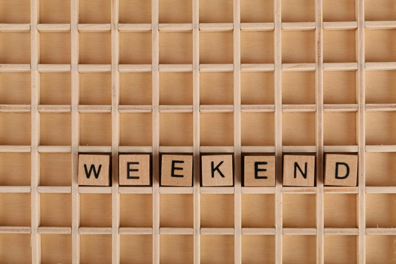 a wooden block with the word weekend spelled on it, trending on pixabay, folk art, grid arrangement, maurizio cattelan, ignant, seen from below