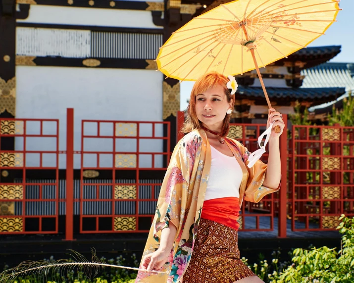 a woman in a kimono is holding an umbrella, unsplash, in disney, felicia day, orange and white, feudal japanese setting