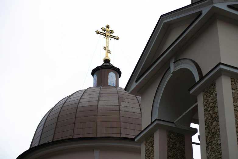 a dome with a cross on top of it, a photo, sofya emelenko, coper cladding, fan favorite, tradition