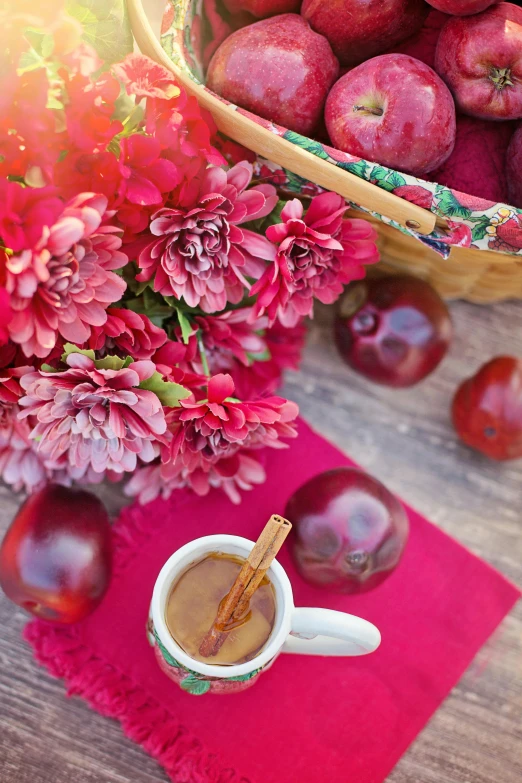 a cup of coffee next to a basket of plums, shutterstock contest winner, romanticism, red and magenta flowers, fall foliage, cinnamon, square