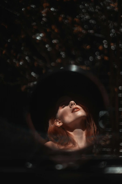 a woman that is standing in the water, an album cover, pexels contest winner, inside of a black hole, ( redhead, dark hat, portrait of a mechanical girl