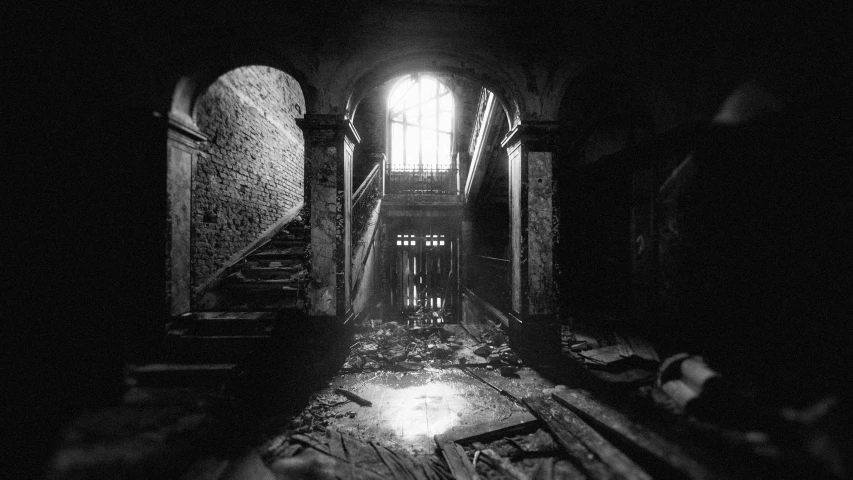 a black and white photo of a dark hallway, a black and white photo, by Aleksander Kobzdej, barbizon school, in the ruins of london, 1990s photograph, atrium, post apocalyptic palace interior