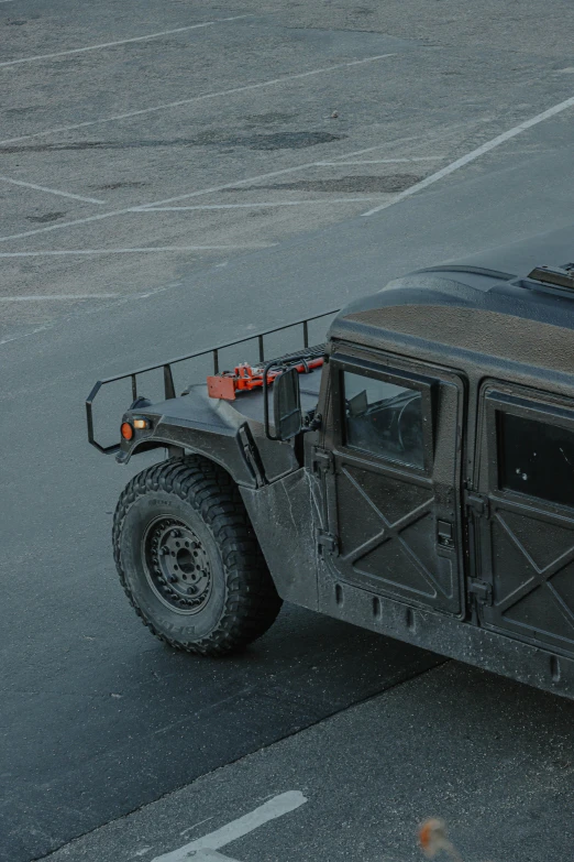 a military vehicle parked in a parking lot, by Jan Tengnagel, unsplash, square, gun metal grey, humvee, extreme detail photo quality