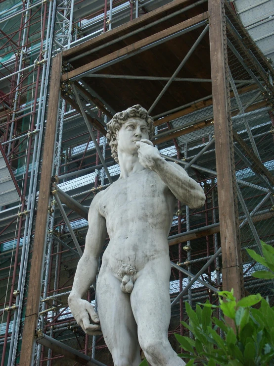 a statue of a man talking on a cell phone, inspired by Michelangelo Buonarotti, pexels contest winner, under construction, shirtless :: high detail, doing a sassy pose, scaffolding