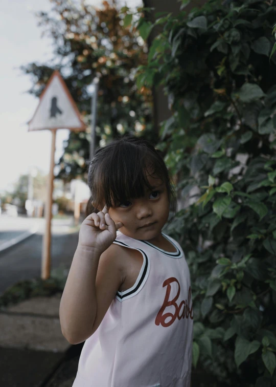 a little girl standing on the side of a road, pexels contest winner, wearing : tanktop, bao pnan, 🤤 girl portrait, with ivy
