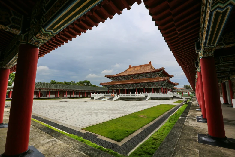 a courtyard with a building in the background, inspired by Wang Yi, pexels contest winner, cloisonnism, okinawa japan, monumental giant palace, square, wide long view