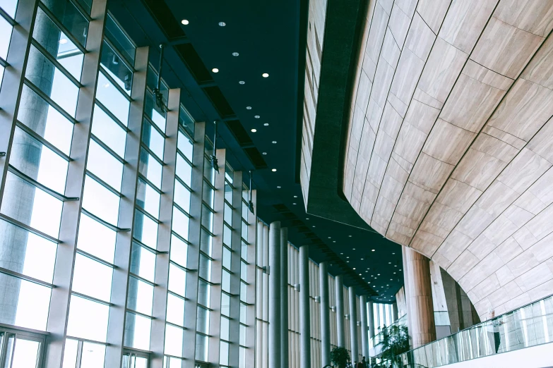 a couple of people that are standing in a building, inspired by Tadao Ando, unsplash contest winner, concert hall, thumbnail, interior shot, video