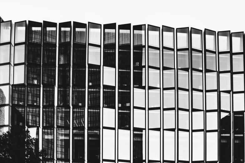 a black and white photo of a tall building, by Kristian Zahrtmann, pexels contest winner, modernism, stacked computer screens, window glass reflecting, illustration, square lines