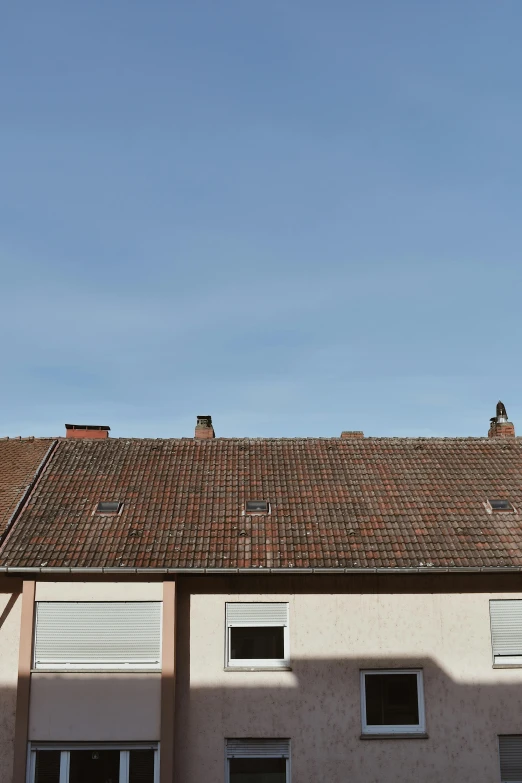 a building with a clock tower in front of it, by Jan Tengnagel, postminimalism, simple gable roofs, panorama, 15081959 21121991 01012000 4k