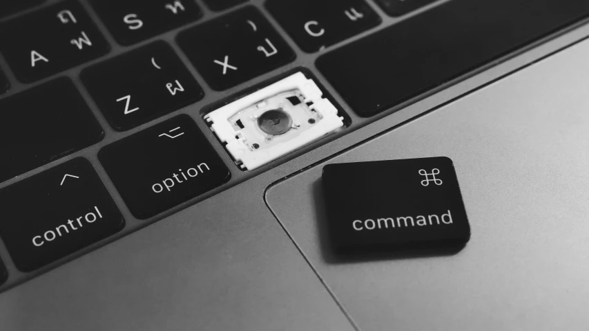 a close up of a keyboard on a laptop, a black and white photo, by Romain brook, unsplash, computer art, command presence, acronym, commander, photo on iphone