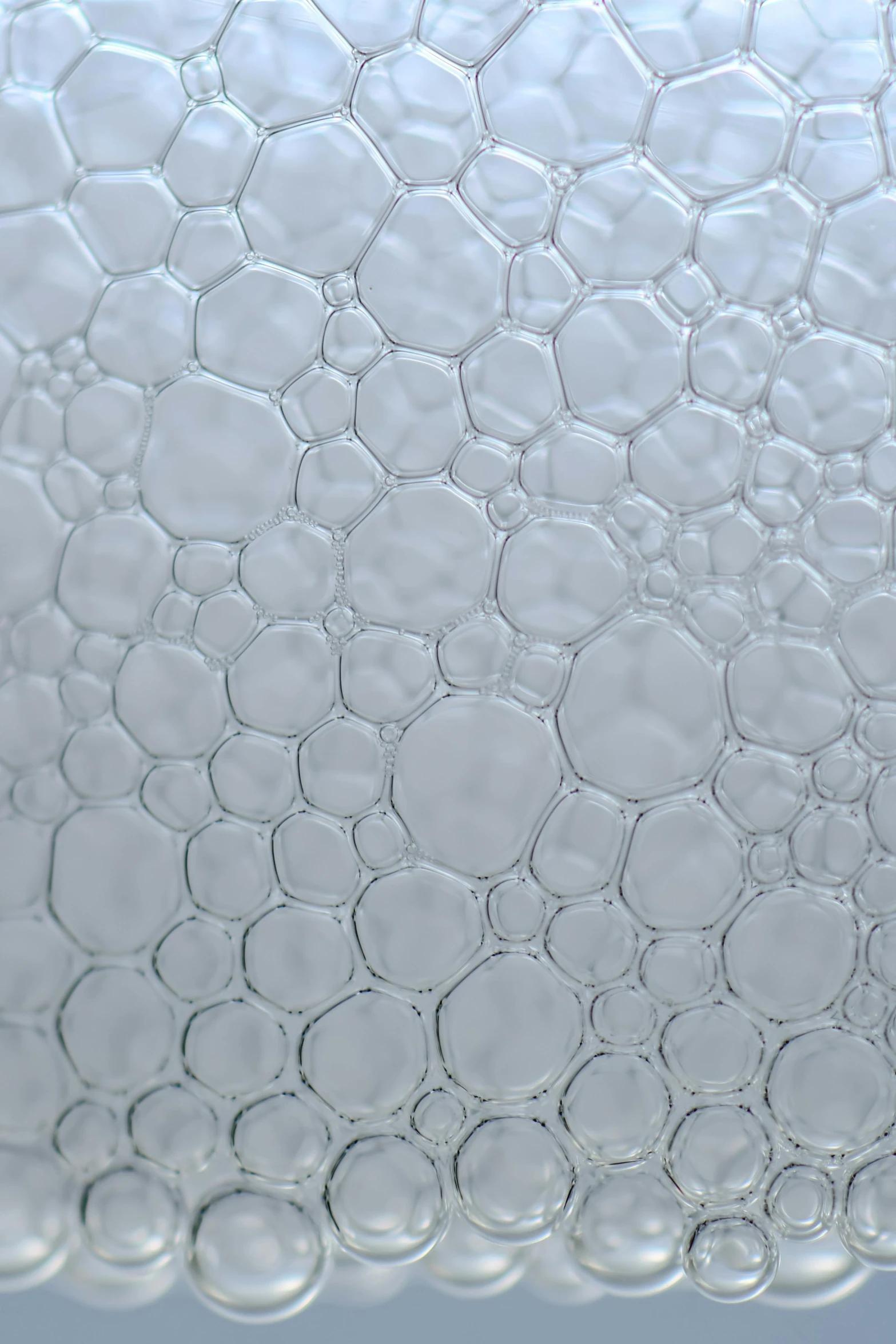 a close up of water bubbles on a surface, inspired by Richard Artschwager, satin silver, opaque glass, mechanically enhanced honeycomb, detailed product image