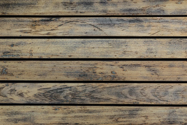 a close up view of a wooden floor, inspired by Andreas Gursky, unsplash, square lines, covered with tar, sitting on a wooden dock, vanilla